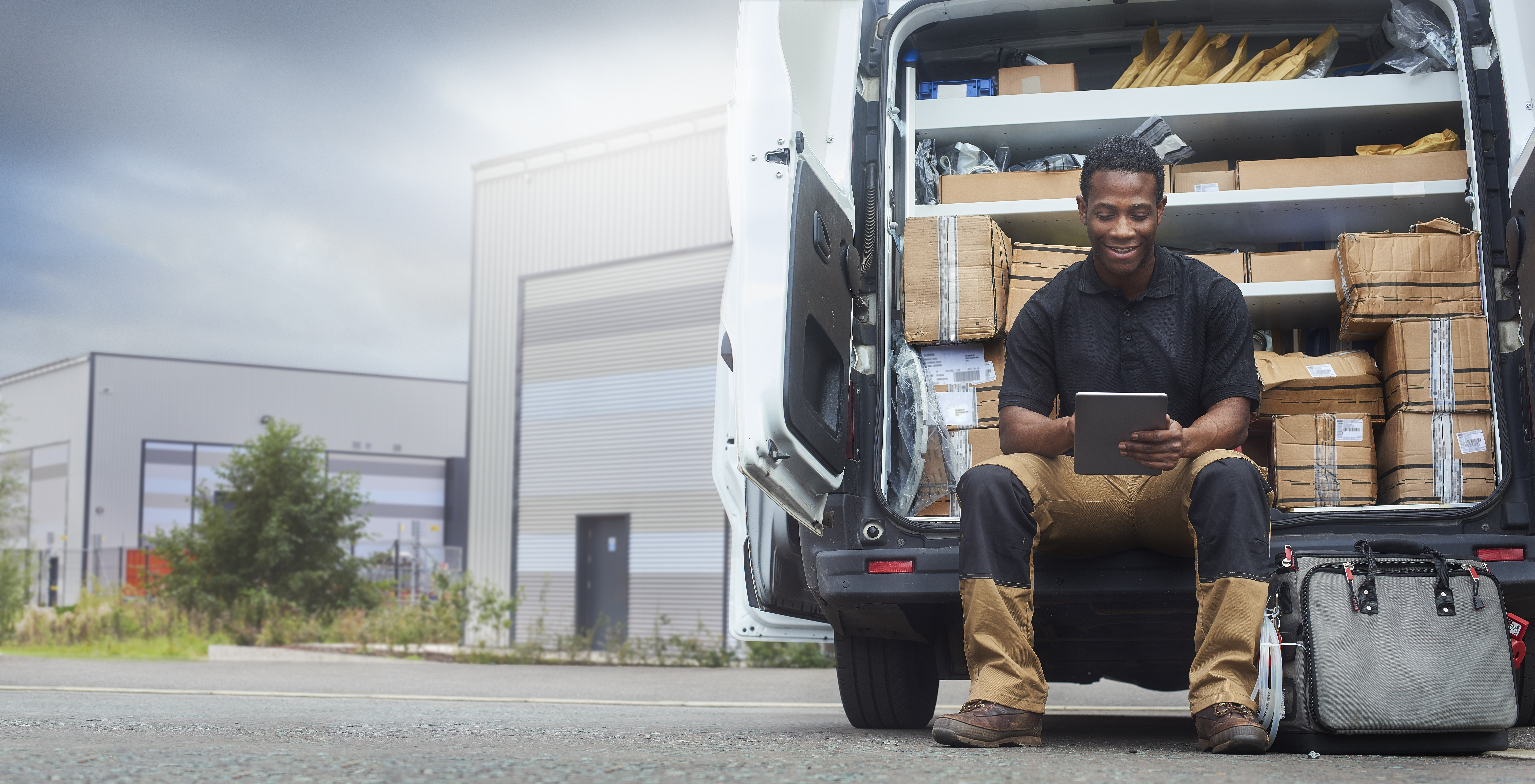 Man Using Tablet Delivering Goods