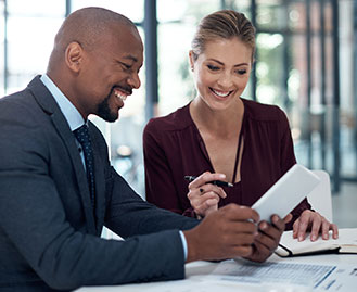 Happy lawyer reviewing documents with client