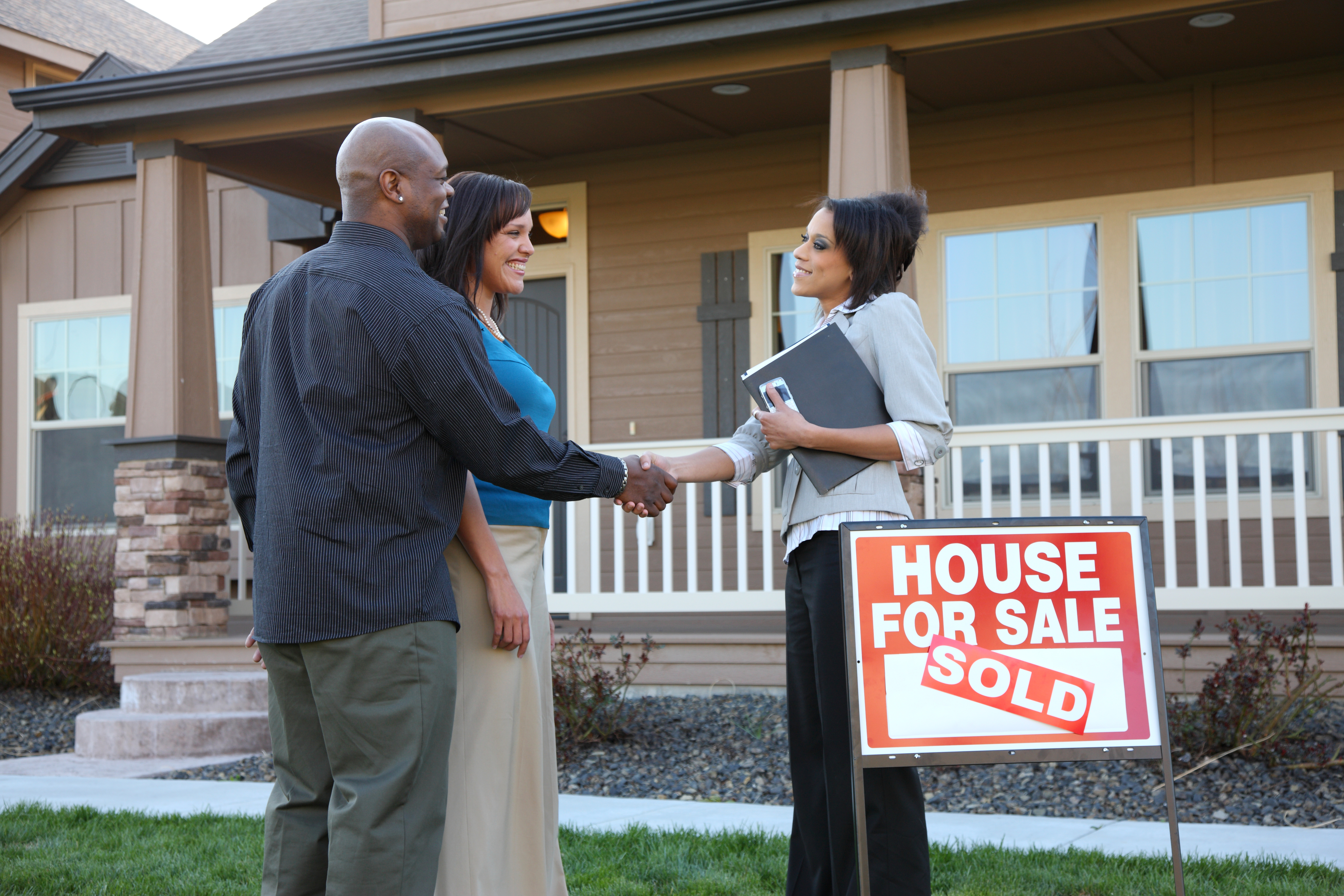 Couple meets a realtor at an open house