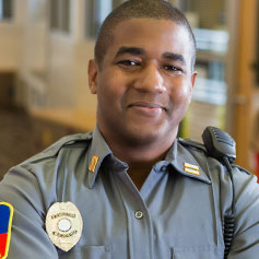 Happy security guy with radio and badge