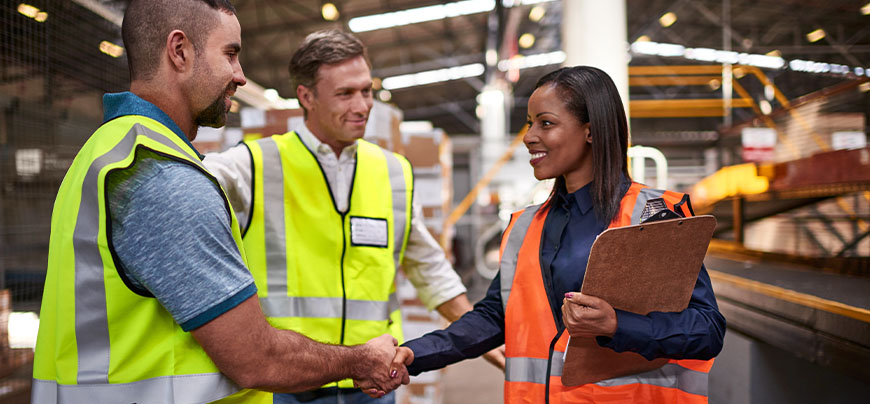 Workers shaking hands