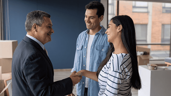 Young couple meets an older man at a house
