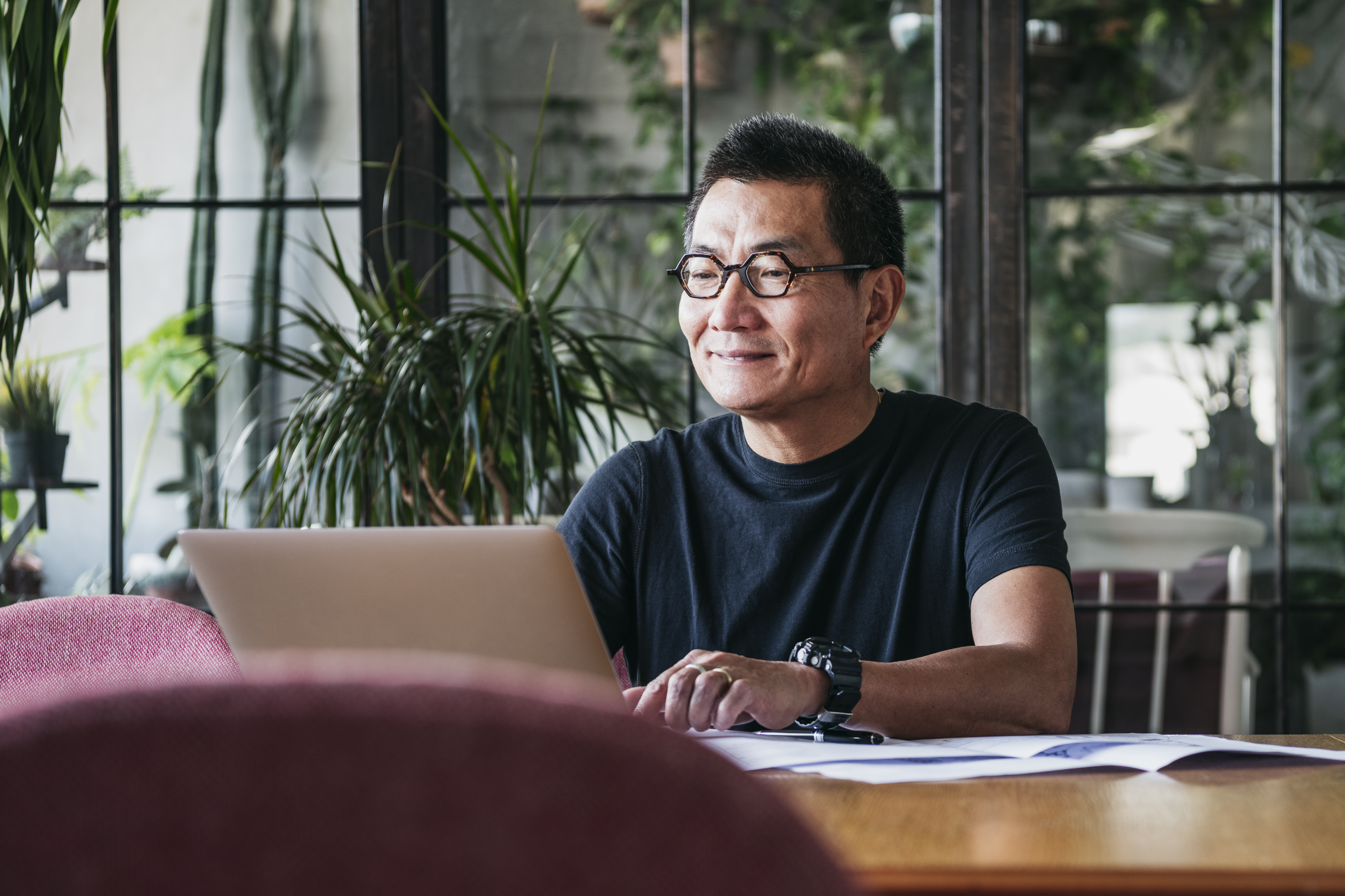 Man looking at laptop smiling