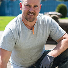 Man smiling and reaching out