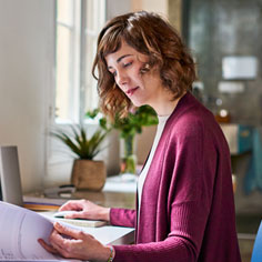 Small business owner reviewing documents