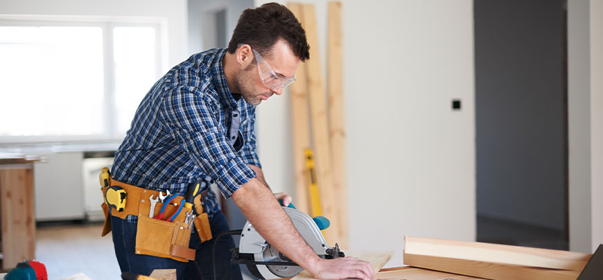Contractor uses a saw