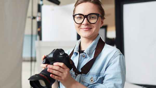 Lady with camera smiling