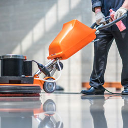 Janitor waxing floor