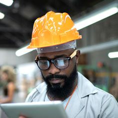 Manufacturing worker looking at tablet