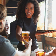 Woman serving beverage