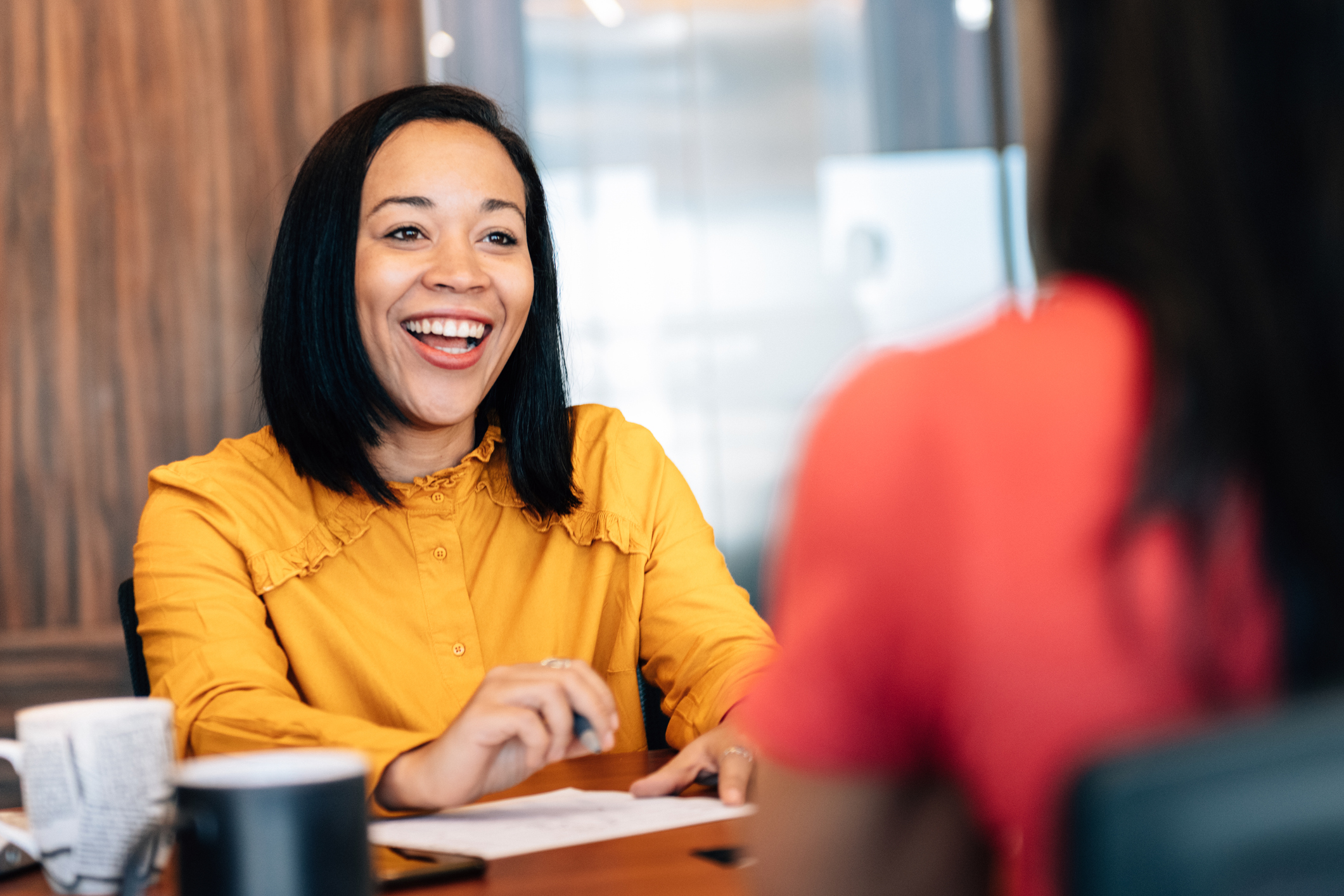 Women happy to have Iowa business insurance